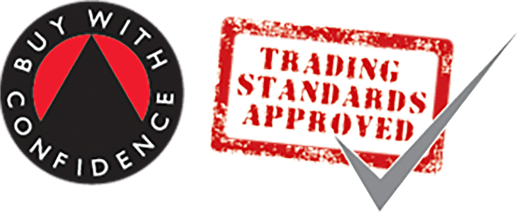 The image features two logos. The first is a black circle bordered by the text "BUY WITH CONFIDENCE" and an upward-pointing red arrow in the center. The second is a red stamp with "TRADING STANDARDS APPROVED" and a large gray check mark overlapping the lower right corner.